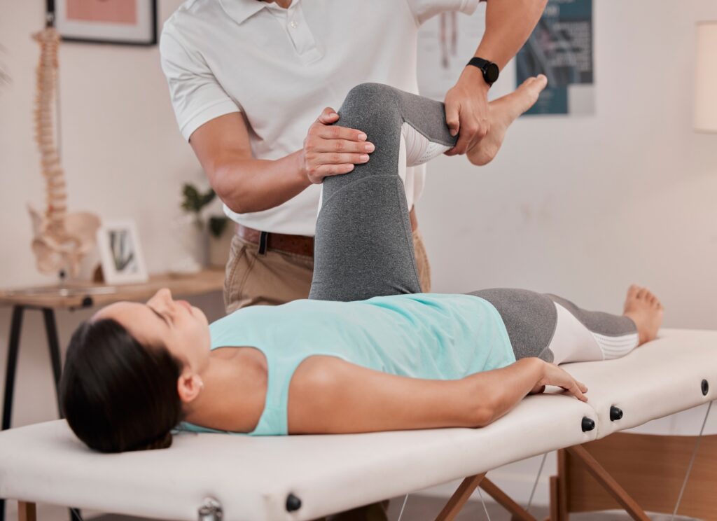 Leg, physiotherapy and healthcare of woman at hospital for rehabilitation, recovery or wellness. He